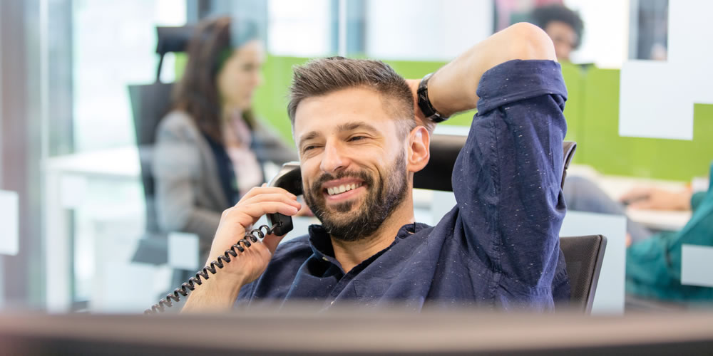 one of our team members on the phone to a client
