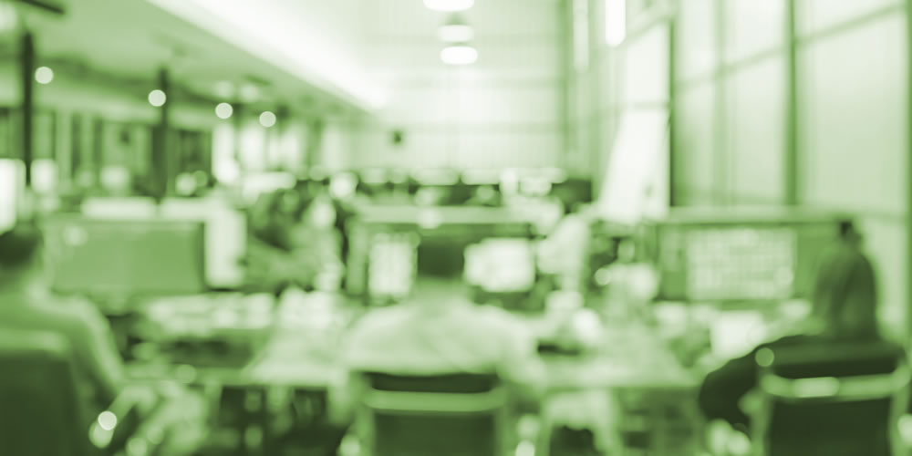 a blurred image of a busy office